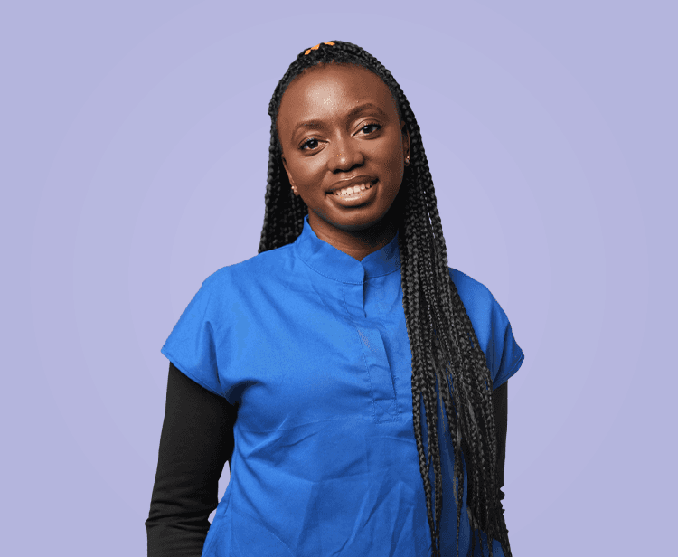Oluwatosin in teal scrubs with notepad